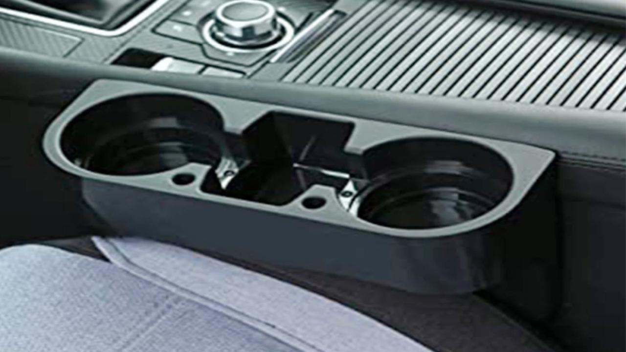 The Hidden Purpose of the Gap Between Car Cup Holders Most Drivers Never Notice