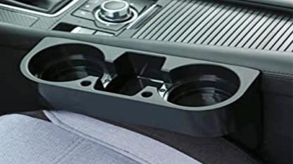 The Hidden Purpose of the Gap Between Car Cup Holders Most Drivers Never Notice